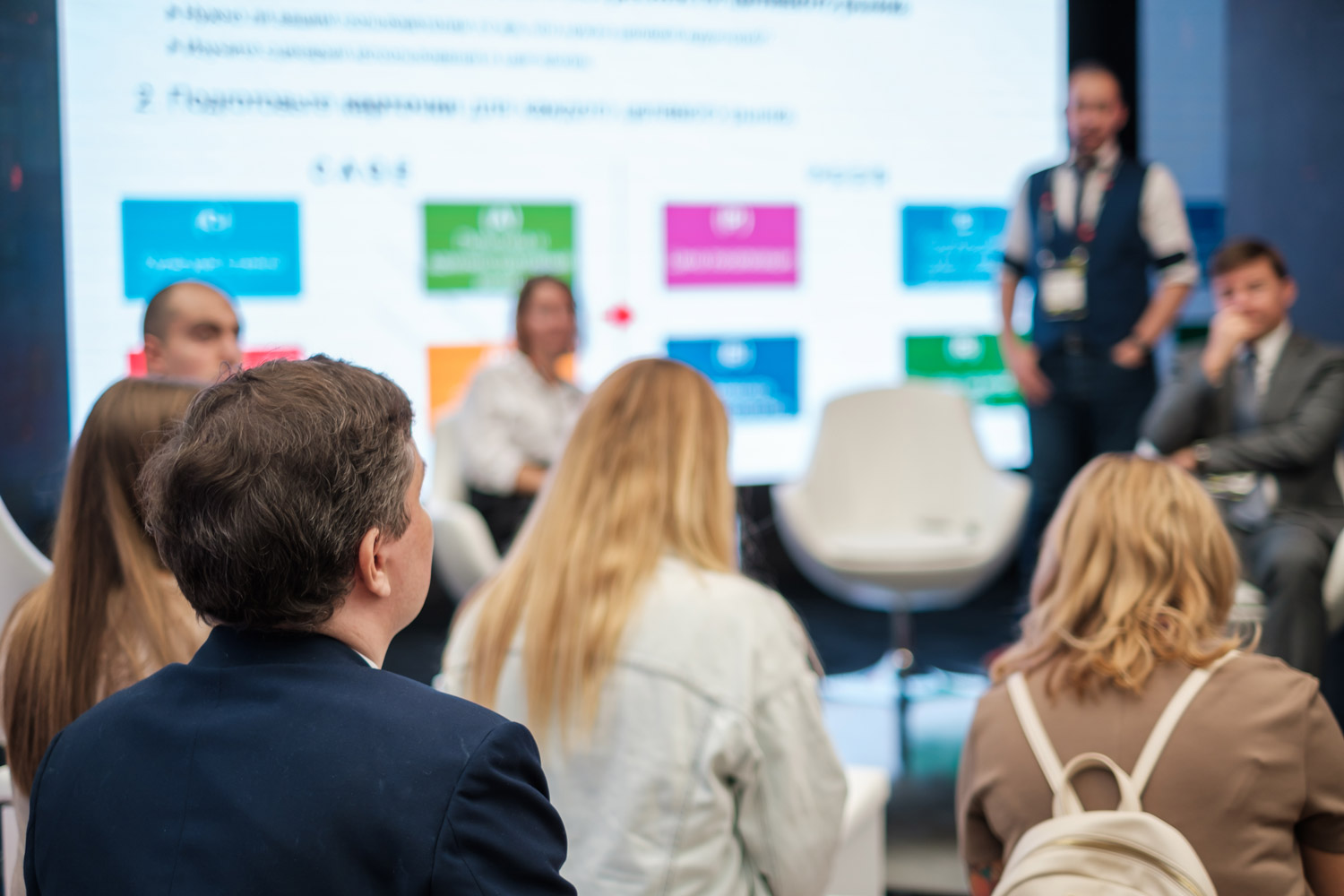 Audience listens to a lecturer at a workshop