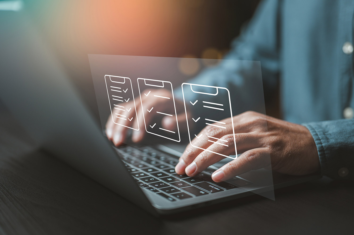 Person typing on laptop keyboard, with checkbox lists floating above